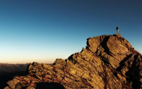 A person on top of a mountain